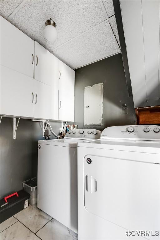 laundry area featuring cabinet space and washing machine and clothes dryer