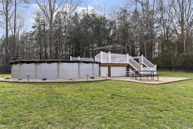 view of yard featuring a swimming pool side deck