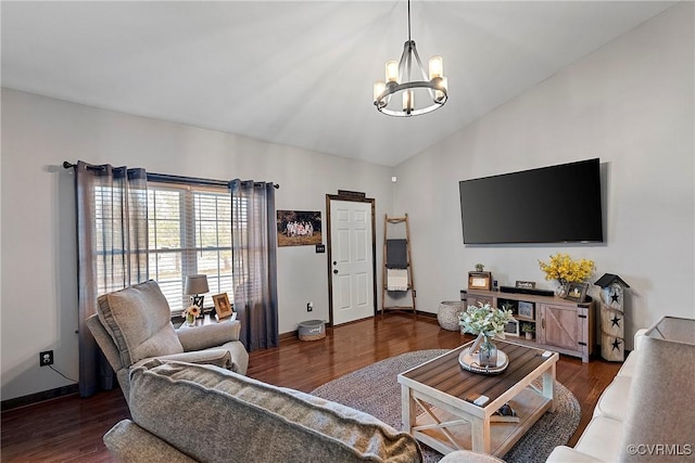 living room featuring dark wood-type flooring, vaulted ceiling, and a notable chandelier