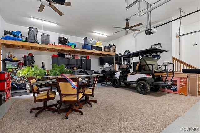 garage featuring a garage door opener and ceiling fan