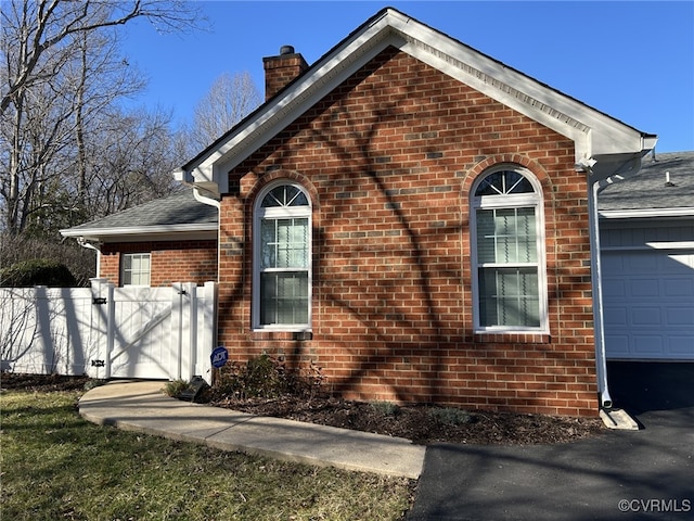 view of side of property featuring a garage