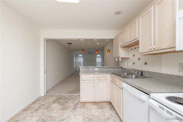 kitchen with pendant lighting, sink, dishwasher, decorative backsplash, and kitchen peninsula