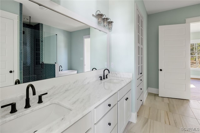 bathroom featuring vanity and a shower with shower door