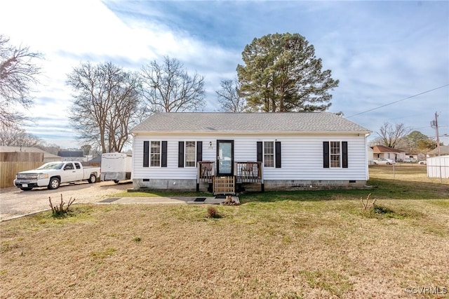 view of front of property featuring a shingled roof, fence, driveway, crawl space, and a front lawn