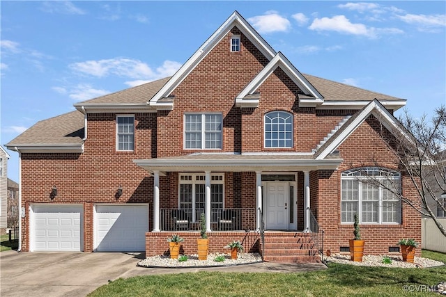 traditional home with roof with shingles, brick siding, covered porch, concrete driveway, and crawl space