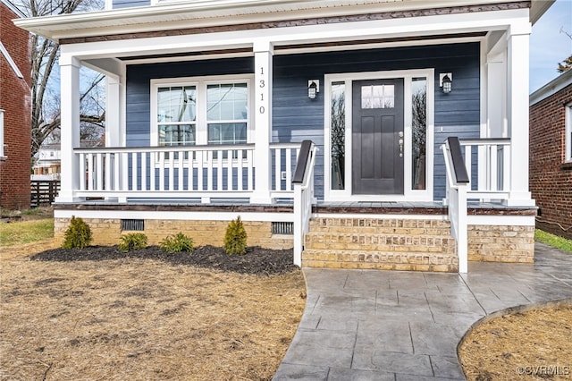 doorway to property with covered porch