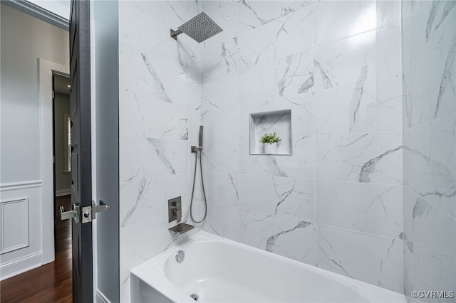 full bathroom featuring bathing tub / shower combination and wood finished floors
