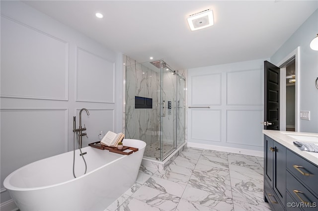 bathroom with vanity and separate shower and tub