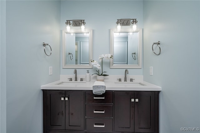 full bath with double vanity and a sink