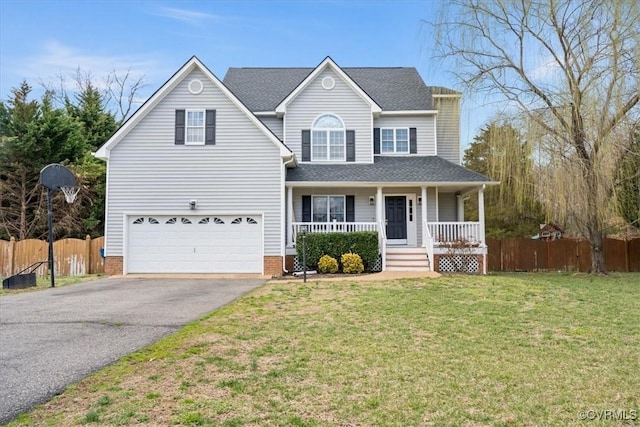 traditional home featuring aphalt driveway, covered porch, fence, and a front lawn