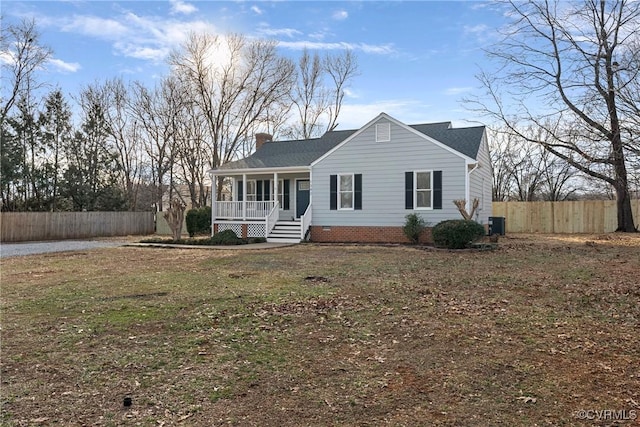 view of front facade featuring a front lawn, central AC, and a porch