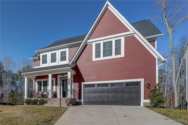 view of front of house with a garage, a front lawn, and a porch