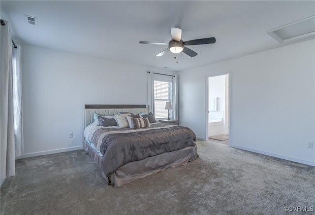 bedroom featuring ceiling fan, ensuite bathroom, and dark colored carpet