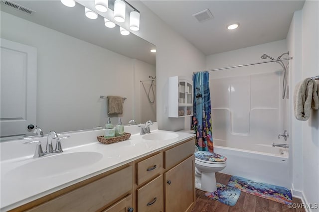 full bathroom featuring shower / bath combo, vanity, wood-type flooring, and toilet