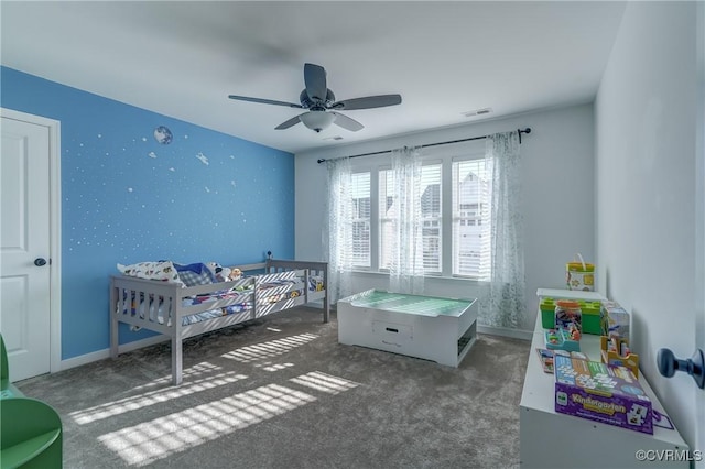 bedroom with dark carpet and ceiling fan