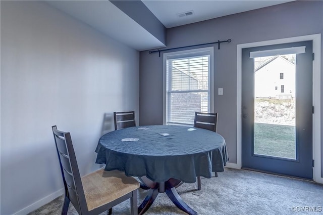 view of carpeted dining area