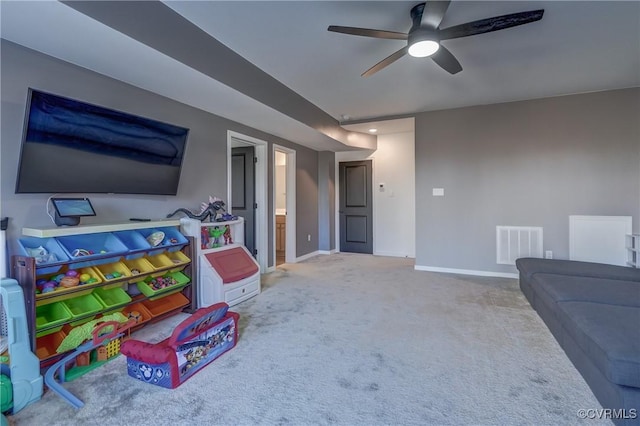 recreation room featuring carpet and ceiling fan