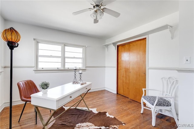 office area with ceiling fan and wood finished floors