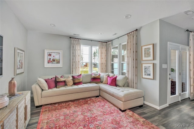 living room with dark hardwood / wood-style floors