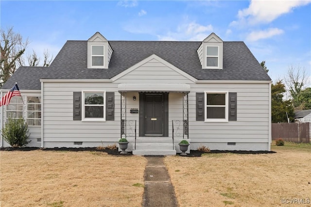 cape cod-style house featuring a front lawn