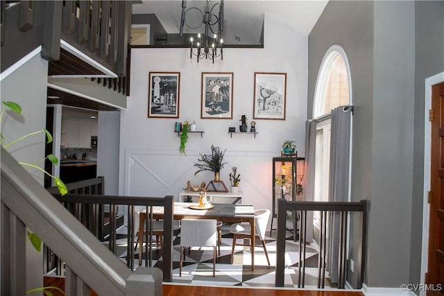 interior space with lofted ceiling and a notable chandelier