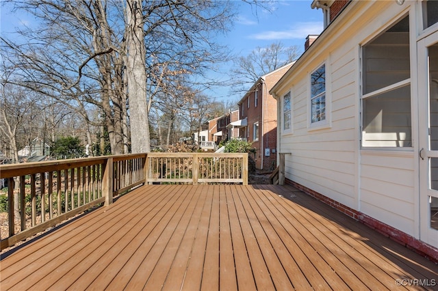 wooden terrace featuring a residential view