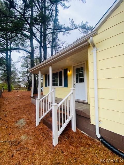 property entrance with a porch