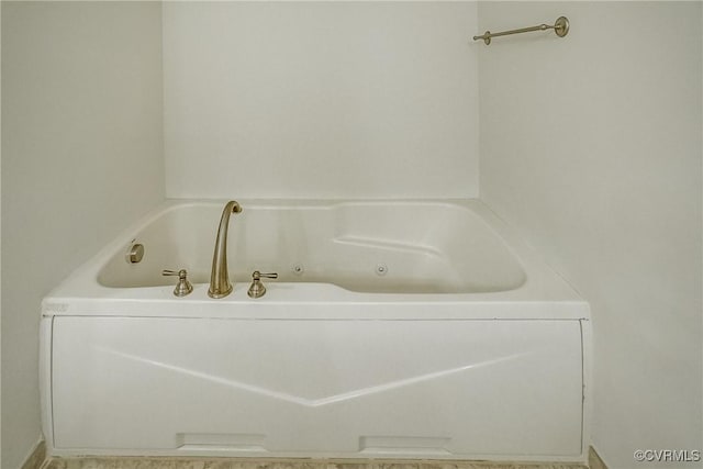 bathroom with a jetted tub