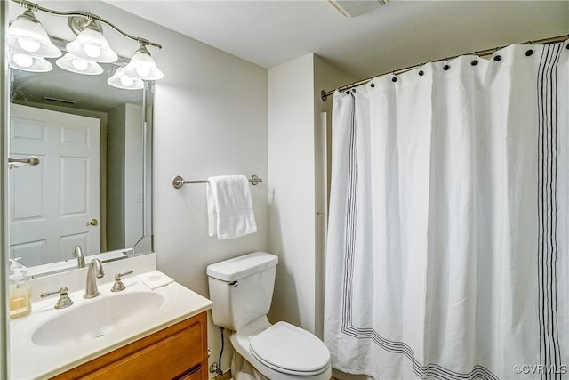 bathroom with a shower with shower curtain, vanity, and toilet