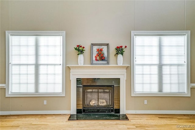 room details featuring baseboards and wood finished floors