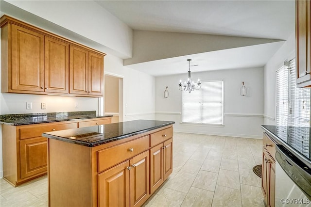 kitchen featuring brown cabinetry, dark stone counters, vaulted ceiling, and dishwashing machine