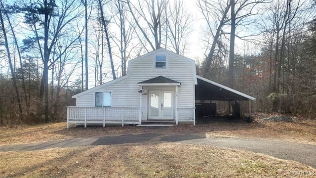 view of front of home featuring a carport and a deck