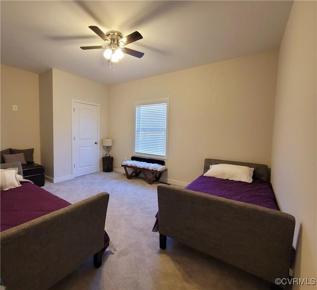 bedroom featuring light colored carpet and ceiling fan