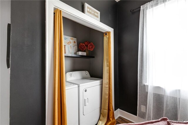 washroom featuring washer and dryer and a healthy amount of sunlight