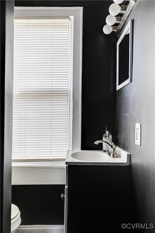 bathroom with vanity and toilet