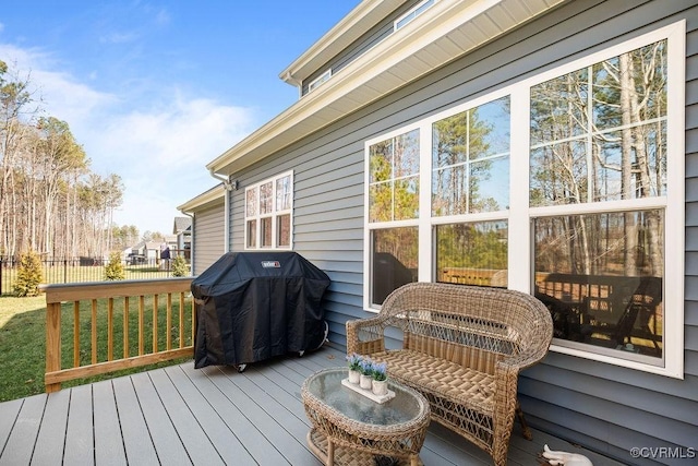 wooden terrace with fence and area for grilling