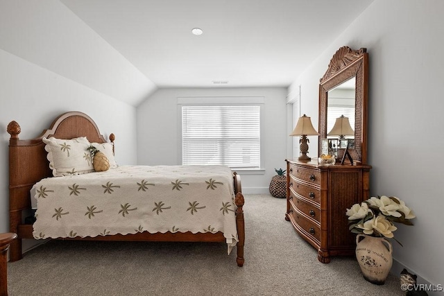 bedroom featuring light carpet, baseboards, visible vents, and lofted ceiling