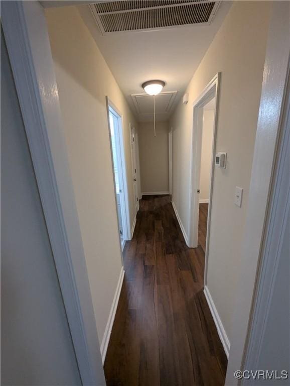 corridor with dark hardwood / wood-style floors