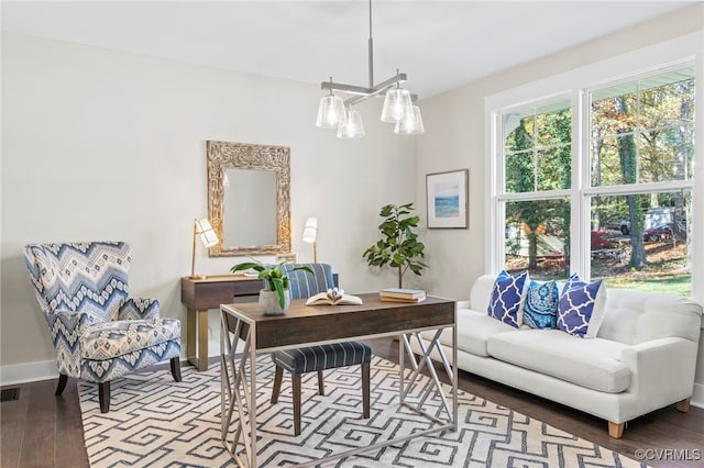 office featuring baseboards and wood finished floors