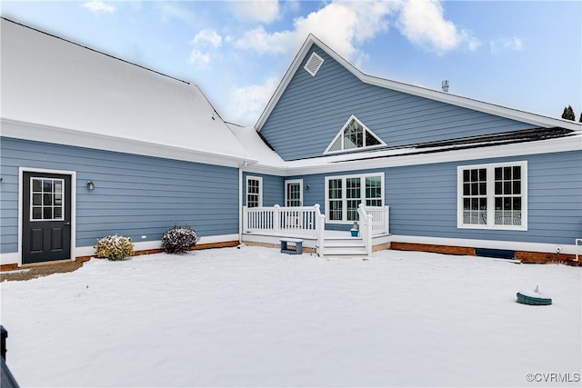 view of snow covered house