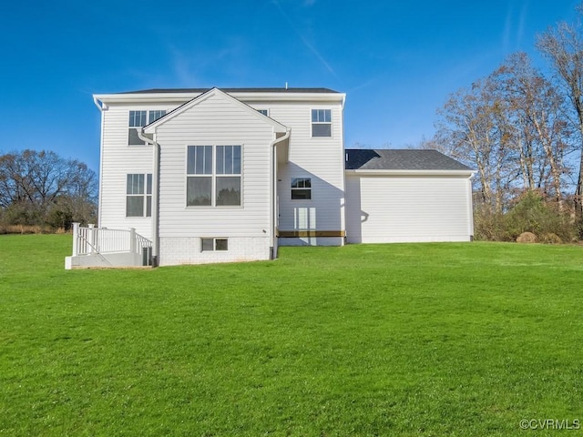 rear view of house with a lawn