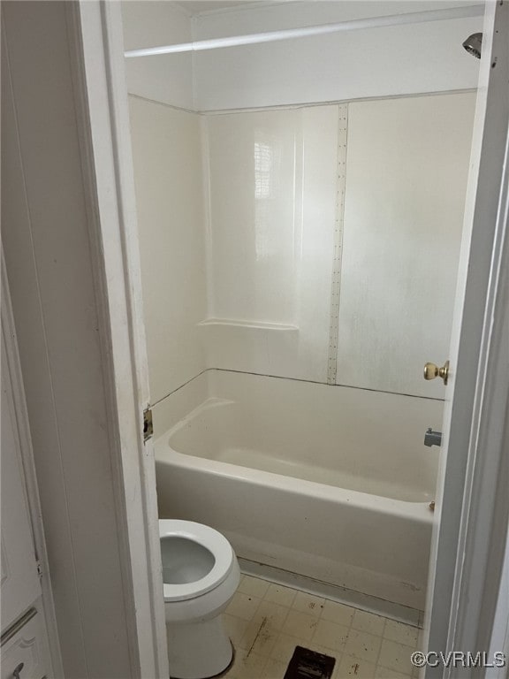 bathroom featuring shower / bathtub combination and toilet