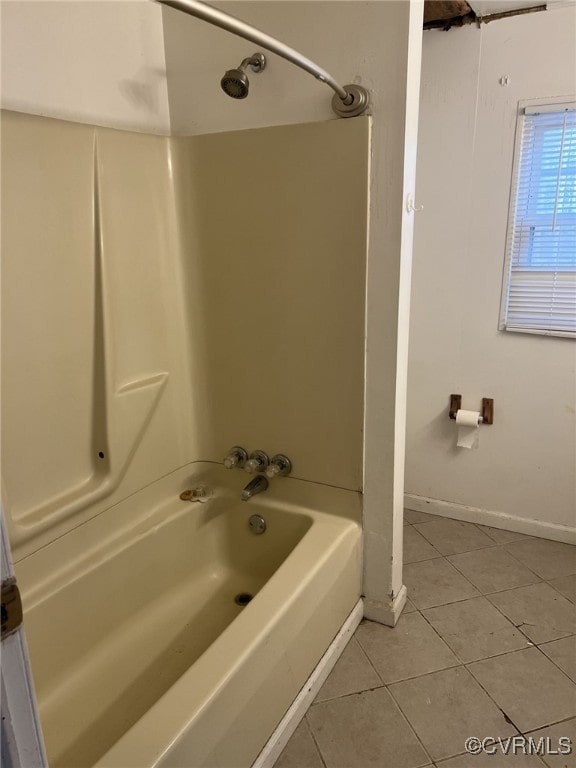 bathroom featuring tile patterned flooring and shower / bathtub combination