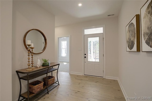 foyer with light hardwood / wood-style floors