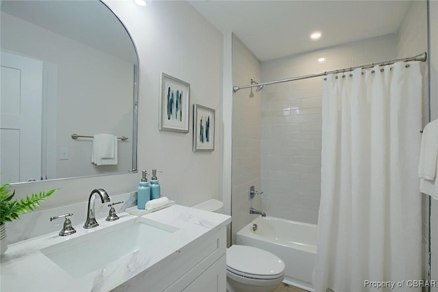 full bathroom featuring vanity, shower / bathtub combination with curtain, and toilet