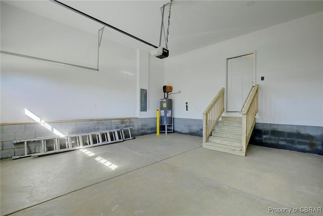 garage featuring a garage door opener and water heater