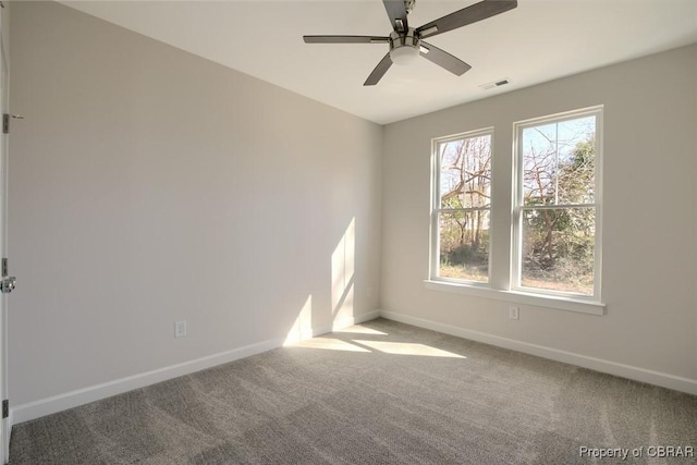 carpeted empty room with ceiling fan