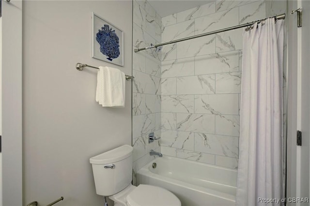 bathroom featuring toilet and shower / bath combo