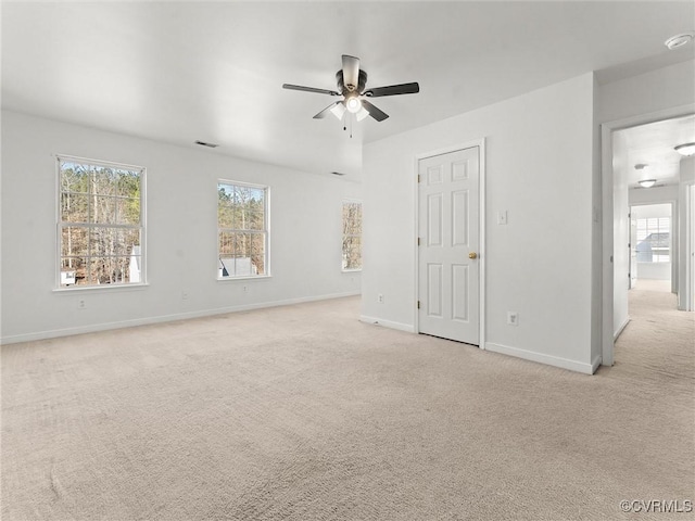 unfurnished bedroom with ceiling fan and light carpet