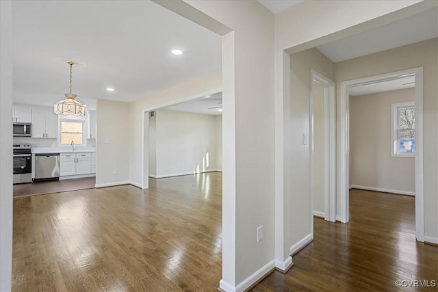 interior space with sink and dark wood-type flooring